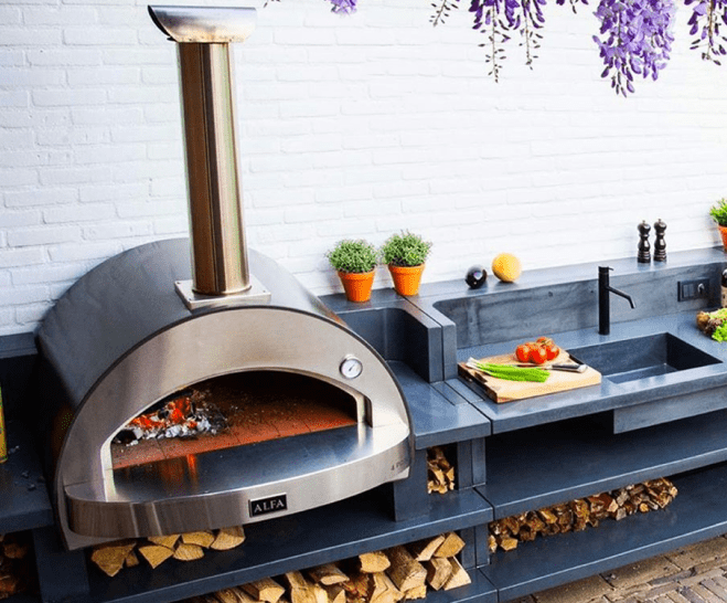 Alfa Oven in outdoor kitchen with white brick back splash
